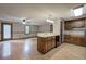 A partial view of a classic kitchen featuring wood cabinets and an open transition to the living room at 191 White Oak Church Rd, Dallas, GA 30157