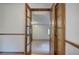 Open French doors leading to a large living room area with a carpeted floor at 191 White Oak Church Rd, Dallas, GA 30157