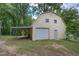An exterior view of a barn-like building with a garage door at 191 White Oak Church Rd, Dallas, GA 30157