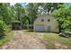 Outbuildings including barn with shed-roofed overhang and garage with covered carport at 191 White Oak Church Rd, Dallas, GA 30157