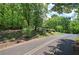 Street view of home's location, featuring trees and landscaping surrounding the home at 191 White Oak Church Rd, Dallas, GA 30157