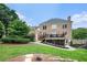 Lush backyard with a brick house, patio, and deck at 2258 Bright Water Dr, Snellville, GA 30078
