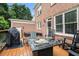 Spacious backyard deck with a fire pit and outdoor furniture perfect for gatherings at 2258 Bright Water Dr, Snellville, GA 30078