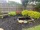 Backyard with Mulch pond and garden at 2258 Bright Water Dr, Snellville, GA 30078