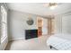 Comfortable bedroom showcasing a neutral color palette, dresser, and adjoining hallway at 2258 Bright Water Dr, Snellville, GA 30078
