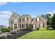 Beautiful brick home with manicured lawn and colorful landscaping at 2258 Bright Water Dr, Snellville, GA 30078