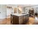 Kitchen island with cooktop, storage and hardwood floors at 2258 Bright Water Dr, Snellville, GA 30078