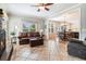 Inviting living room featuring tiled floor, view of the kitchen and fireplace at 2258 Bright Water Dr, Snellville, GA 30078