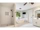 Elegant main bathroom featuring a soaking tub, separate shower, and stylish design at 2258 Bright Water Dr, Snellville, GA 30078