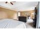 Spacious main bedroom featuring a seating area, tray ceiling, and neutral color palette at 2258 Bright Water Dr, Snellville, GA 30078