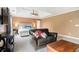 Comfortable main bedroom features a tray ceiling, seating area, and adjoining bathroom at 2258 Bright Water Dr, Snellville, GA 30078