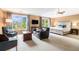 Bright and airy main bedroom offering large windows, a seating area, and a king-size bed at 2258 Bright Water Dr, Snellville, GA 30078