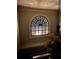 Stairway landing features a beautiful arched window with stained glass at 2258 Bright Water Dr, Snellville, GA 30078