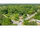 Aerial view of a property in a wooded area, outlined by property lines, near an intersection at 2667 Peyton Nw Rd, Atlanta, GA 30318