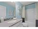 Bright bathroom with shower-tub combo and gray vanity with ample counter space at 82 Hydrangea Cir, Fairburn, GA 30213