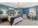 Cozy bedroom showcases coastal artwork, neutral tones, a desk, and comfortable furniture at 82 Hydrangea Cir, Fairburn, GA 30213