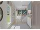 Inviting entryway with light wood floors, modern decor, and staircase leading to the upper level at 82 Hydrangea Cir, Fairburn, GA 30213