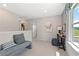 Bright hallway featuring neutral tones, a comfortable bench, and natural light, creating an inviting transition space at 82 Hydrangea Cir, Fairburn, GA 30213