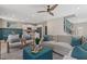 Spacious living room with modern decor, natural light, and seamless flow to kitchen and entryway at 82 Hydrangea Cir, Fairburn, GA 30213