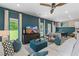 Stylish living room featuring modern decor, a ceiling fan, and an abundance of natural light at 82 Hydrangea Cir, Fairburn, GA 30213