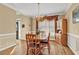 Dining room with wood floors, chandelier, and view to the front of the house at 902 Laurel Crest Dr, Woodstock, GA 30189