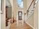 Welcoming foyer with hardwood floors, staircase, and a view of the front door at 902 Laurel Crest Dr, Woodstock, GA 30189