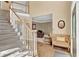 Inviting foyer featuring hardwood floors, carpeted stairs, and a view into the office at 902 Laurel Crest Dr, Woodstock, GA 30189