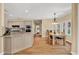 Bright eat-in kitchen with breakfast nook, modern appliances, hardwood floors and granite countertops at 902 Laurel Crest Dr, Woodstock, GA 30189