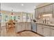Kitchen with modern countertops and cabinets, stainless steel dishwasher, eat in dining area and hardwood floors at 902 Laurel Crest Dr, Woodstock, GA 30189