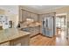 Spacious kitchen with stainless steel appliances, granite countertops and eat-in dining area at 902 Laurel Crest Dr, Woodstock, GA 30189