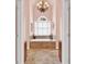 Elegant main bathroom with soaking tub, arched window, and decorative chandelier at 902 Laurel Crest Dr, Woodstock, GA 30189