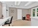 Home office featuring built-in shelves, desk space, and a comfortable chair near the window at 902 Laurel Crest Dr, Woodstock, GA 30189