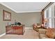 Office with a large desk, comfortable seating, and bright natural light at 902 Laurel Crest Dr, Woodstock, GA 30189