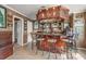 Custom bar area with seating and decorative accents creating an ideal space for entertaining at 160 Oak Manor Dr, Covington, GA 30016
