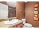 Bathroom featuring a wood vanity, single sink and framed mirror at 160 Oak Manor Dr, Covington, GA 30016
