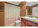 Cozy bathroom features a vanity with a sink, a toilet, and a shower with a curtain at 160 Oak Manor Dr, Covington, GA 30016