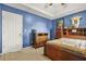 Bedroom with blue walls featuring sports decorations and a double bed at 160 Oak Manor Dr, Covington, GA 30016