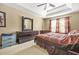 Bedroom boasts a large dresser with mirror, matching furniture, and plenty of natural light at 160 Oak Manor Dr, Covington, GA 30016