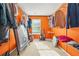 Walk-in closet with shelving, window, and orange walls at 160 Oak Manor Dr, Covington, GA 30016