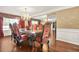Elegant formal dining room featuring a chandelier and a large dining table at 160 Oak Manor Dr, Covington, GA 30016