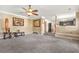 Bright living room open to the kitchen with elegant decor and ample space for furnishings at 160 Oak Manor Dr, Covington, GA 30016