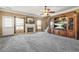 Open living room featuring a fireplace, media center, and ample natural light at 160 Oak Manor Dr, Covington, GA 30016
