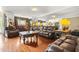 Living room with wood flooring, mirrored wall, elegant furniture, and natural light at 160 Oak Manor Dr, Covington, GA 30016