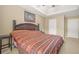 Spacious main bedroom features a tray ceiling, large bed, and carpeted floor at 160 Oak Manor Dr, Covington, GA 30016