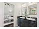 Bathroom featuring double sinks, granite countertop, and mirror at 382 Lofton Nw Rd, Atlanta, GA 30309