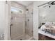 Bathroom featuring glass shower door and natural light at 382 Lofton Nw Rd, Atlanta, GA 30309