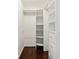 Walk-in closet featuring custom shelves, drawers, and ample storage space with modern design at 382 Lofton Nw Rd, Atlanta, GA 30309