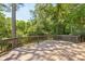 Spacious wooden deck surrounded by mature trees, offering privacy and room for outdoor entertaining at 382 Lofton Nw Rd, Atlanta, GA 30309