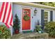 Charming exterior shot featuring a red front door with a wreath, complemented by an American flag at 382 Lofton Nw Rd, Atlanta, GA 30309