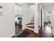 Hallway with hardwood floors leading to the staircase and bedroom at 382 Lofton Nw Rd, Atlanta, GA 30309